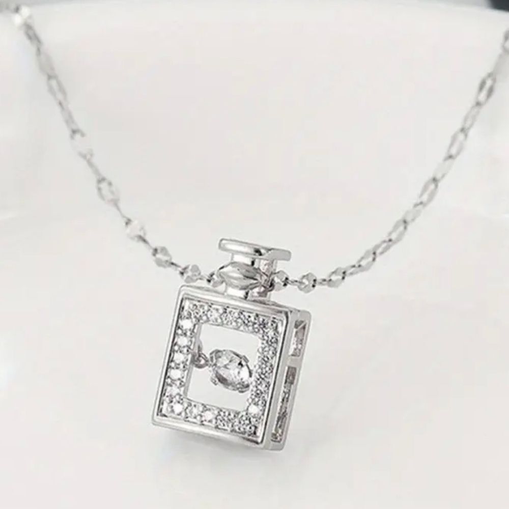 Silver Perfume Bottle with Dancing Diamond In Motion